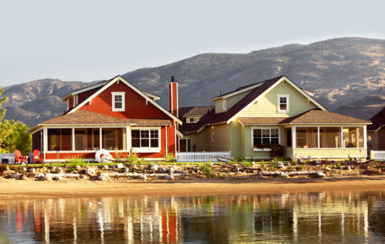 Beach houses on a waterfront.