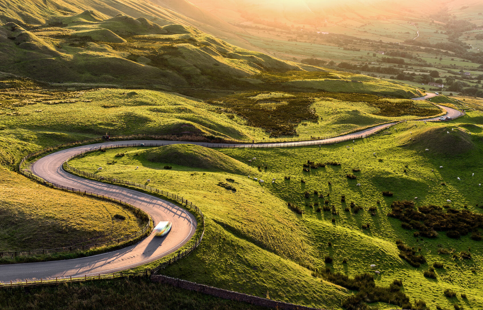 A curvy road passes over hills