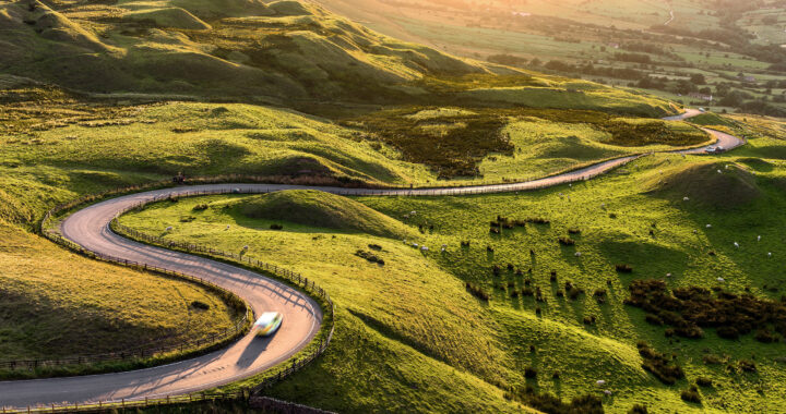 A curvy road passes over hills