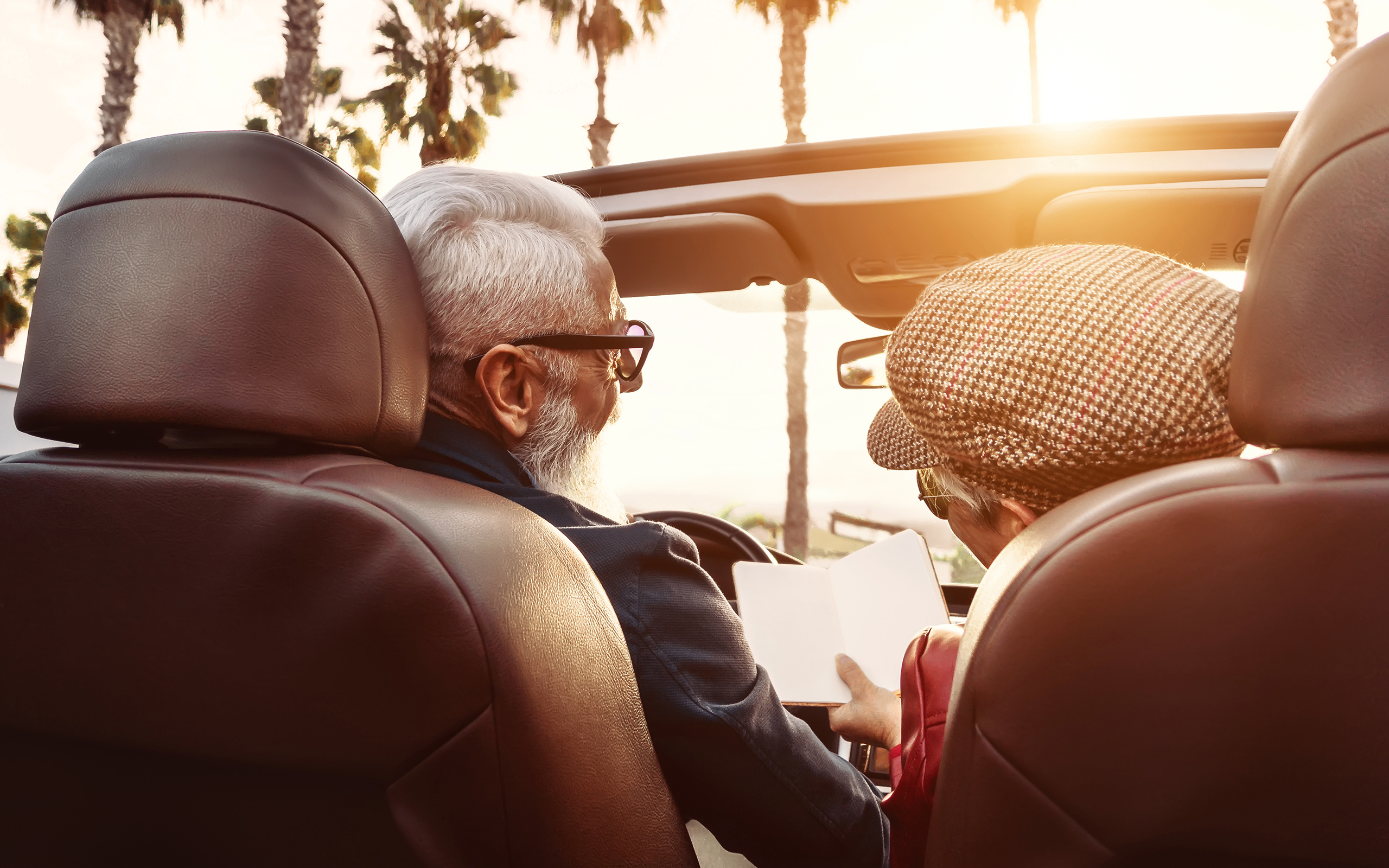 A couple in a car discusses their next destination.
