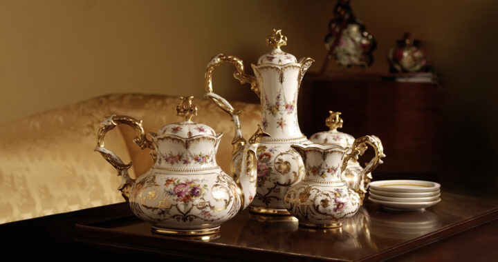 An antique porcelain tea set displayed on a table