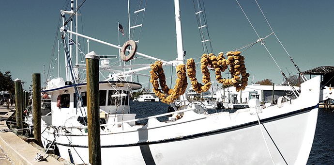 A sponge boat docked at a Tarpon Springs Florida dock.