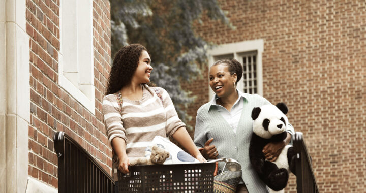 Mother helping daughter move into dormitory.