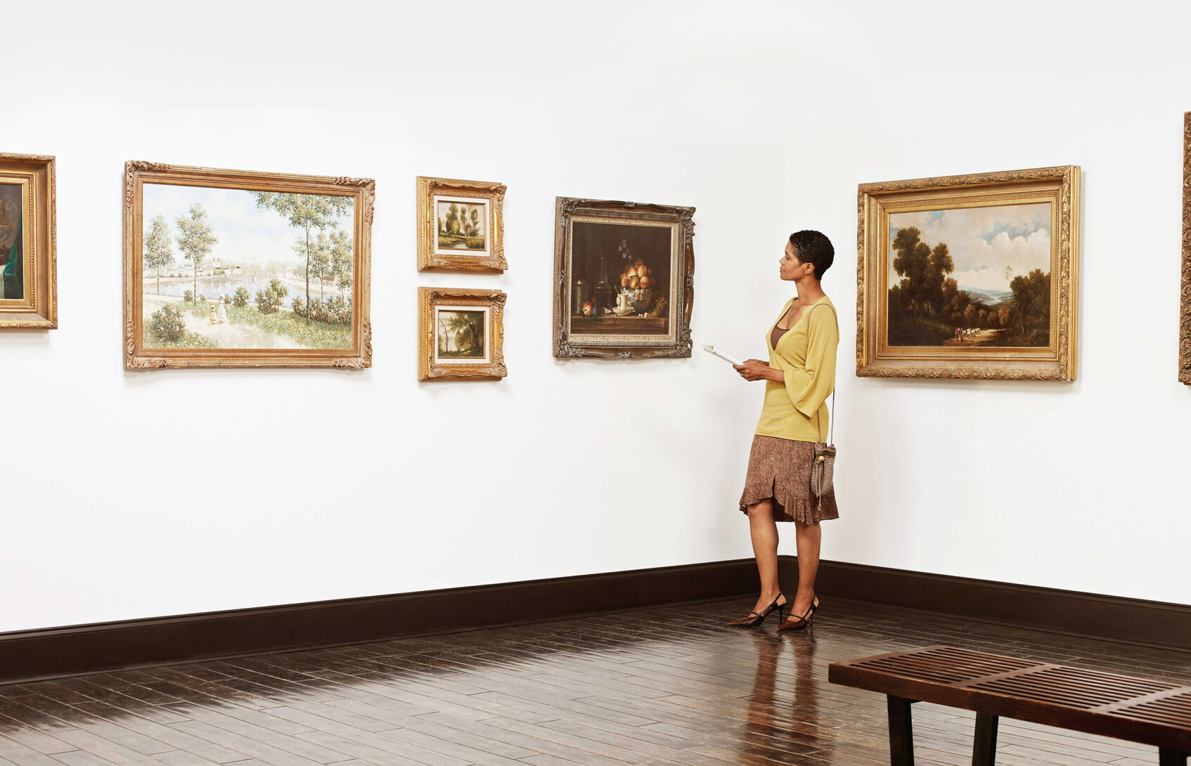 Woman standing in art gallery.