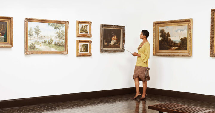 Woman standing in art gallery.