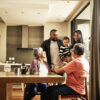 A multigenerational family talking in the kitchen