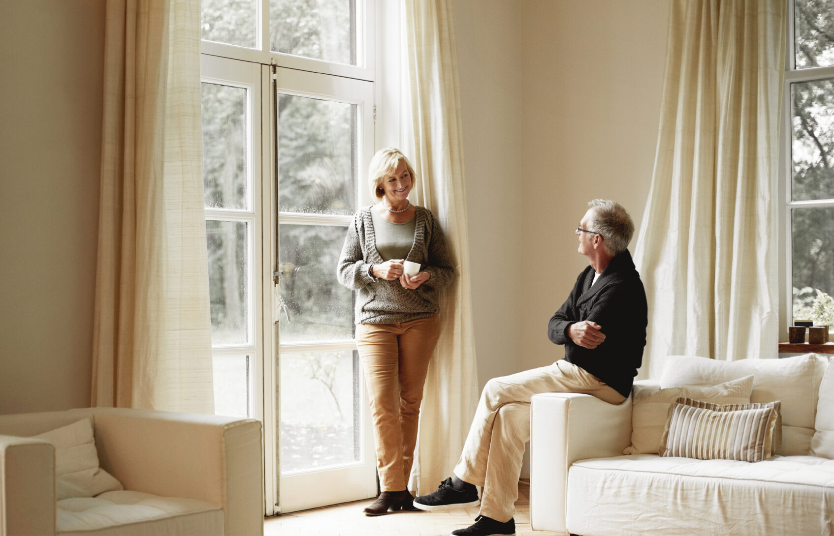 A couple having a discussion in the living room