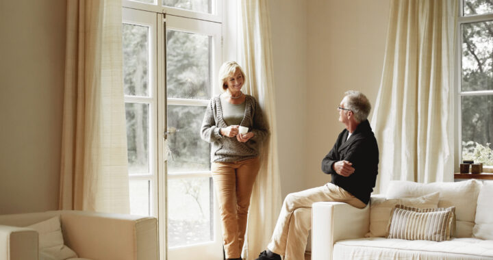A couple having a discussion in the living room
