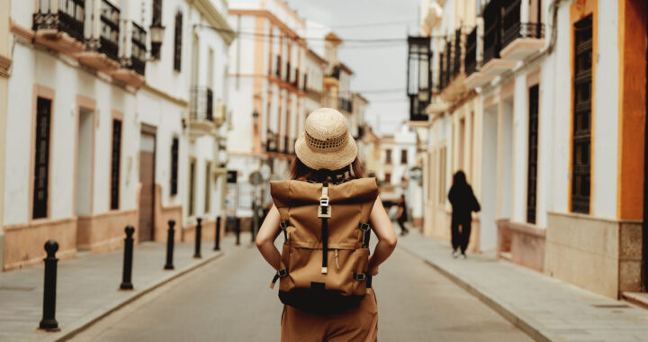 Rear view of female backpacker.